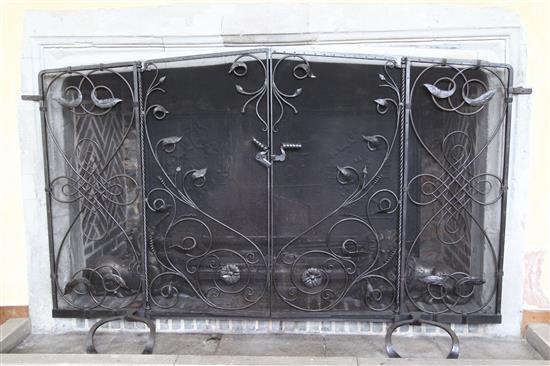 A large wrought iron and wire mesh chimneypiece spark guard, approx. W.6ft 6.6in. H.4ft 1.5in.